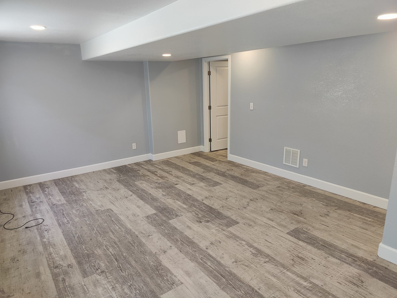 Finished basement with luxury vinyl plank flooring in Westminster, CO