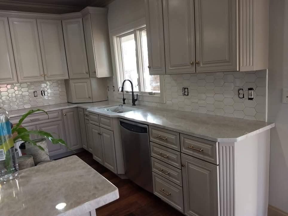 Kitchen remodel with gray cabinets and picket tile backsplash