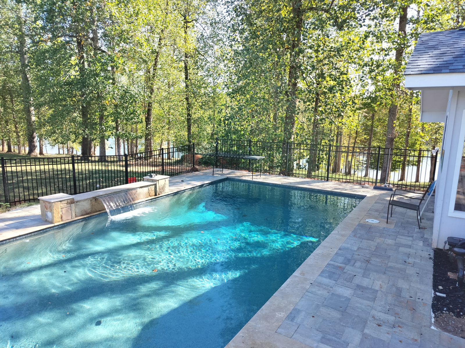 Paver patio and iron fence installation